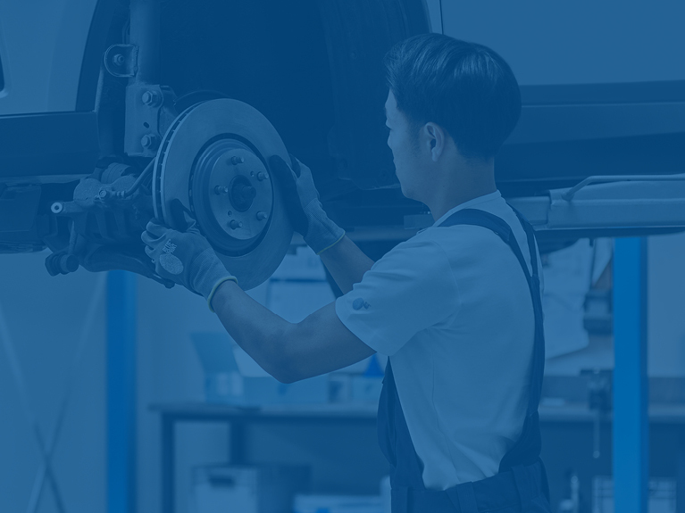 Mechanic mounting new brake disc