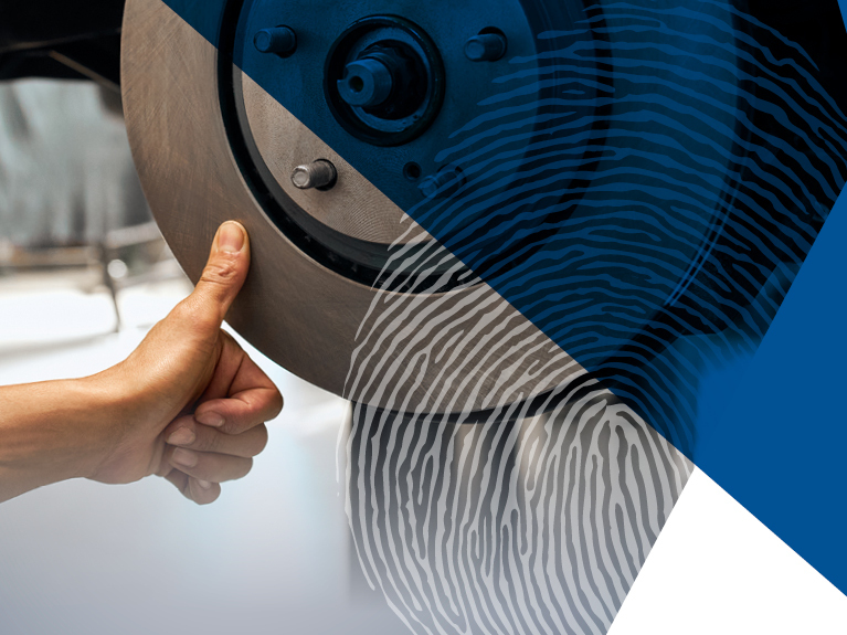 Close-up of thumbprint onto a brake disc