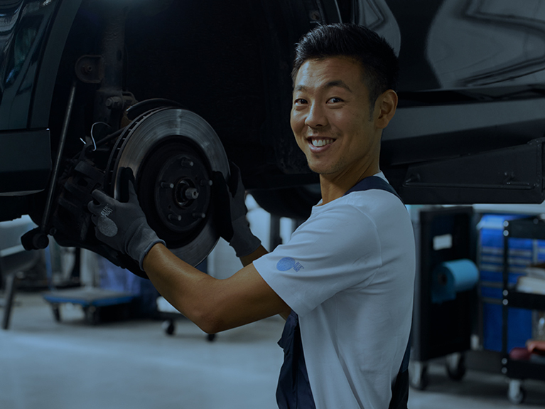 Mechanic mounting new brake disc