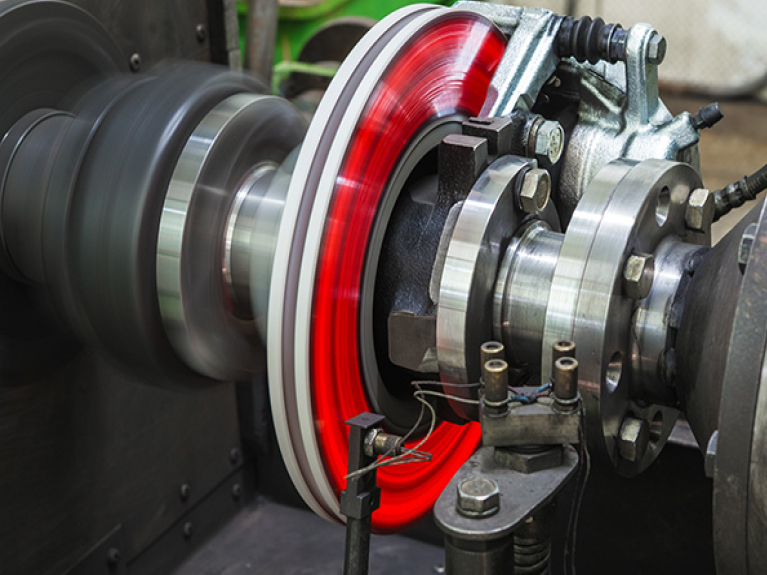 A car brake system in action with a heated brake disc