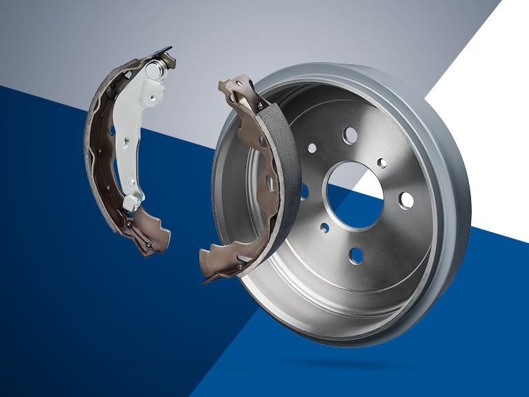 Close-up of a mechanic pressing on new brake pads