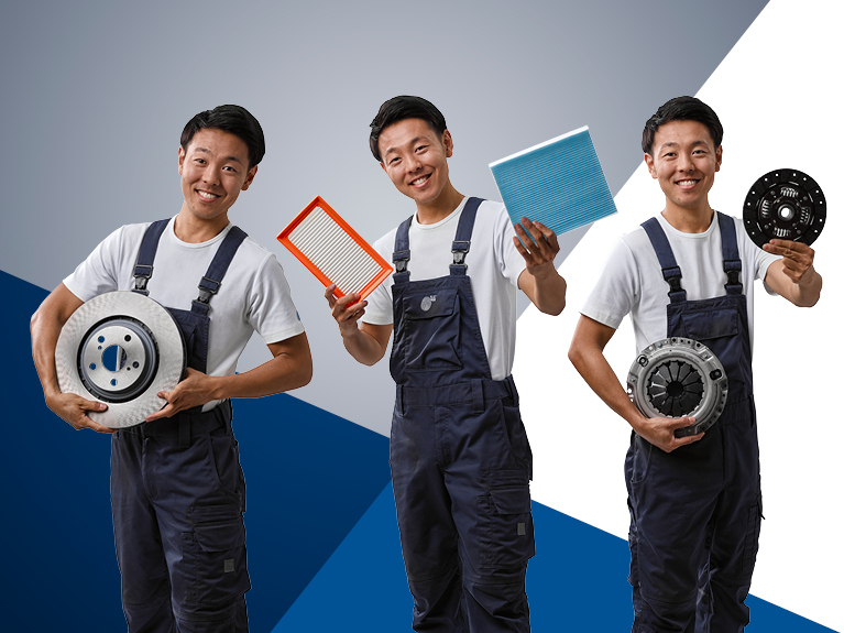 Three car mechanics present replacement parts from the central product groups of filtration, braking and clutch
